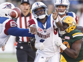 Montreal Alouettes quarterback Darian Durant (4) is hit by Edmonton Eskimos' Kwaku Boateng (93) during first half CFL action in Edmonton on Friday, June 30, 2017.