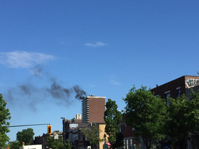 Smoke is seen coming from a highrise in the Plateau area on Wednesday, June 7, 2017.