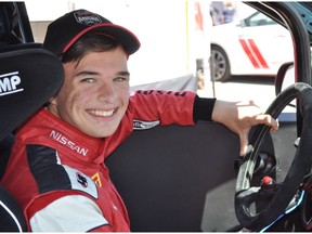Former kart champion Austin Riley, an 18-year-old from Uxbridge, Ont., who was diagnosed as being high-function autistic when he was 12, poses in the car he is driving as a rookie in the 2017 Micra Cup season.