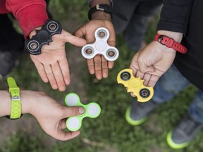 Frankfurt customs authorities said Friday, June 16, 2017 they confiscated 35 tons of fidget spinners in May alone and plan on crushing them out of existence. (Alessandro della Valle/Keystone via AP, file)