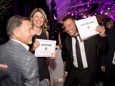 9 0402 SIGNING ON TO SOCIAL MEDIA: From left, Daniel Simoni, Sarah Côté, and John Masella share sentiments on Social Media at the annual ICCF Governors' Ball "The Party" in Windsor Station's salle des pas perdus. JOHN OLIVERI PHOTOGRAPHY