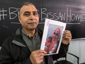 Hadi Eid holds up a photograph of his daughter, Bissan, and her seven-month-old baby. Bissan, who has been stuck in Gaza for over six months, is finally returning to Montreal on Friday.