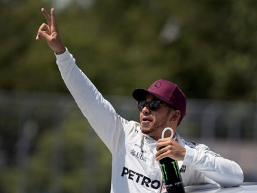 Lewis Hamilton of Mercedes Petronas waves to fans after winning the pole position during qualifying at the Canadian Formula 1 Grand Prix at Circuit Gilles Villeneuve in Montreal on Saturday, June 10, 2017.