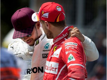Mercedes Petronas Lewis Hamilton hugs Sebastian Vettel of Ferrari after Hamilton secured the pole position and Vettel the No. 2 spot on the starting grid during qualifying at the Canadian Formula 1 Grand Prix at Circuit Gilles Villeneuve in Montreal on Saturday, June 10, 2017.