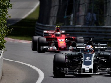 Romain Grosjean of Haas F1 leads Kimi Raikkonen through a turn during qualifying at the Canadian Formula 1 Grand Prix at Circuit Gilles Villeneuve in Montreal on Saturday, June 10, 2017.