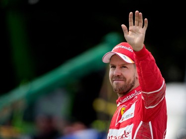 Sebastian Vettel of Ferrari waves to fans after securing the number two spot on the starting grid during qualifying at the Canadian Formula 1 Grand Prix at Circuit Gilles Villeneuve in Montreal on Saturday, June 10, 2017.