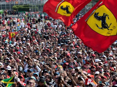 Racing fans crowd around the podium to see Lewis Hamilton during the Canadian Formula 1 Grand Prix at Circuit Gilles Villeneuve in Montreal on Sunday, June 11, 2017.