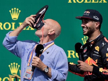 Sir Patrick Stewart drinks champagne from Red Bull Racing's Daniel Ricciardo's shoe after the Canadian Formula 1 Grand Prix at Circuit Gilles Villeneuve in Montreal on Sunday, June 11, 2017. Ricciardo took third place.