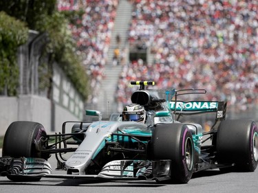 Valtteri Bottas of Mercedes Petronas works his way out of the Senna Turn as he takes the second-place finish during the Canadian Formula 1 Grand Prix at Circuit Gilles Villeneuve in Montreal on Sunday, June 11, 2017.