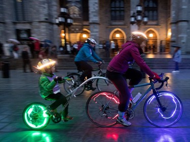 Cyclists peddle past the Notre-Dame Basilica during the Tour de nuit in Montreal on Friday, June 2, 2017.