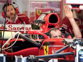 Ferrari mechanics test Sebastian Vettel's car at Circuit Gilles Villeneuve on Thursday June 8, 2017.