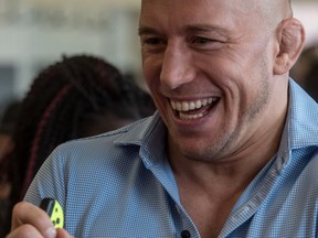MMA fighter Georges St-Pierre was on hand to compete with children at Nintendo's ARMS video game setup at Centre Père Sablon in Montreal on Friday, June 9, 2017.