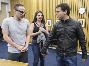 Seymour Krelborn, played by Benjamin Warner, left, watches Franco DeCrescentis, playing Orin Scrivello, D.D.S, berating Audrey, played by Sarah Kulaga-Yoskovitz during rehearsal of the Côte-St-Luc Dramatic Society's production of Little Shop of Horrors.