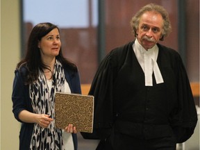 Adele Sorella walks to court in her trial in the deaths of her two daughters with lawyer Guy Poupart at the Palais de Justice de Laval in Laval on May 29, 2013.