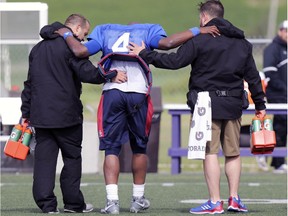 Alouettes quarterback Darian Durant had to be helped off the field after injuring his left knee during training camp at Bishop's University on Tuesday.