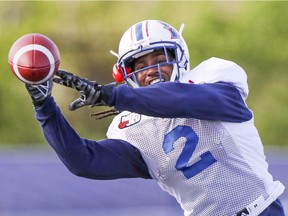 Reciever Deandre Reaves reaches for a pass during Montreal Alouettes training camp at Bishop's University in Lennoxville, southeast of Montreal Tuesday May 30, 2017.