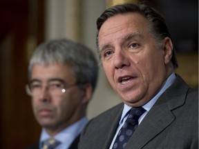 CAQ Leader François Legault and then-MNA Stéphane Le Bouyonnec, now CAQ party president, are seen in this 2013 file photo. "We want to give a signal that the CAQ is a party which is open and actively looking for candidates who can carry the colours in all regions of Quebec," Le Bouyonnec says.