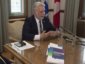 Quebec Premier Philippe Couillard during an interview with The Canadian Press Wednesday, May 31, 2017 at his office in Quebec City. Couillard called on the prime minister to read his plan on eventually launching new constitutional talks before closing the door on the matter.