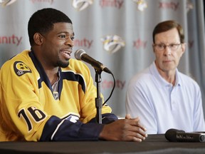 Nashville Predators defenseman P.K. Subban, left, speaks at a news conference Monday, July 18, 2016, in Nashville, Tenn. Subban was acquired from the Montreal Canadiens in a trade for defenseman Shea Weber in June. Predators general manager David Poile, right, looks on. (AP Photo/Mark Humphrey)