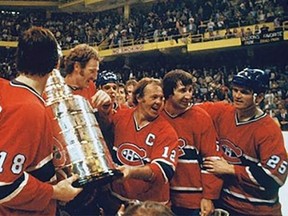 (From left to right) Serge Savard, Larry Robinson, captain Yvan Cournoyer, Guy Lapointe and Jacques Lemaire celebrate their 1976-77 Stanley Cup win.