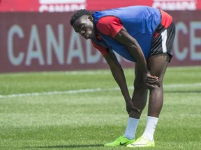 Canada's Alphonso Davies, 16, stretches during a team practice on Monday, June 12, 2017 in Montreal.