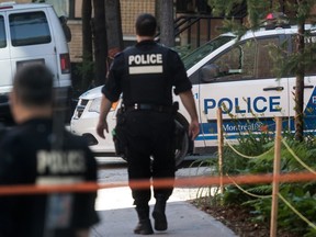 Montreal police are seen at the scene of 2017 shooting of Pierre Coriolan in this file photo.