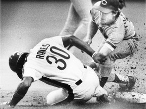 July 23, 1987: Tim Raines slides in safely under Reds' Curt Stilwell.