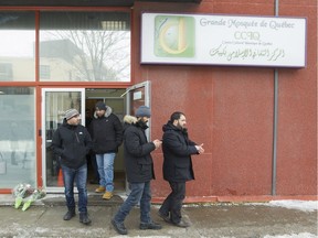 Members of the Centre Culturel Islamique de Québec in Quebec City, exit the building, Wedesday February 1, 2017