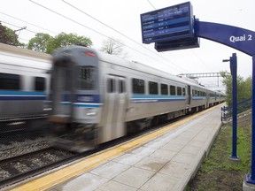 Commuter train leaves Mount-Royal station on its way to Deux-Montagnes, right, while the other pulls away from Central Station on Monday May 11, 2015.