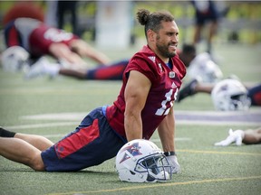 Montreal Alouettes linebacker Chip Cox stretches during training camp at Bishop's University in Lennoxville, southeast of Montreal Monday May 29, 2017.