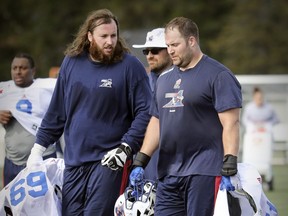 Offensive linemen Jacob Ruby, left, shown here with Christian Matte at Alouettes training camp  last  May, was released from the Alouettes Wednesday.