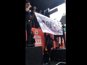 Black Lives Matter protesters take to the stage at the Montreal International Jazz Festival on July 2, 2017.