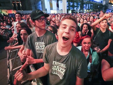 Walk Off the Earth fans sing along with the band during outdoor blowout concert at the Montreal International Jazz Festival in Montreal Tuesday July 4, 2017.