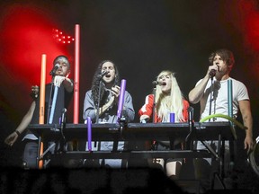 Walk Off the Earth, from left, Joel Cassady, Gianni Luminati, Sarah Blackwood and Ryan Marshall perform at the outdoor blowout concert at the Montreal International Jazz Festival in Montreal Tuesday July 4, 2017.