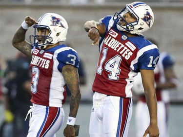 Montreal Alouettes kicker Boris Bedé and holder Vernon Adams celebrate Bedé's field goal during first half of Canadian Football League game against the British Columbia Lions in Montreal Thursday July 6, 2017.