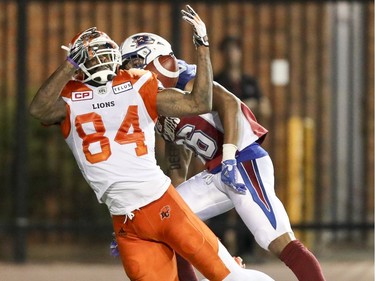 Montreal Alouettes defensive back Tyree Hollins interferes with British Columbia Lions receiver Emmanuel Arceneaux in the end zone during second half of Canadian Football League game in Montreal Thursday July 6, 2017.
