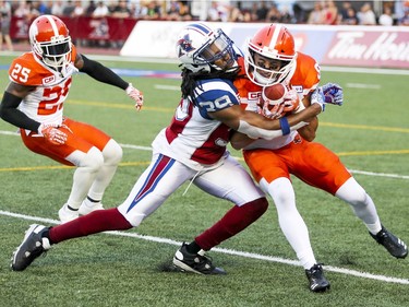 Montreal Alouettes Donald Unamba Jr. tackles British Columbia Lions punt returner Marco Iannuzzi during first half of Canadian Football League game in Montreal Thursday July 6, 2017. Lions Ronnie Yell watches at left.