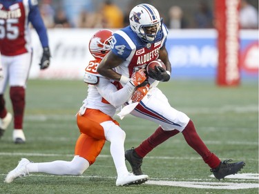Montreal Alouettes receiver George Johnson is takled by British Columbia Lions Anthony Gaitor during first half of Canadian Football League game in Montreal on July 6, 2017. The Alouettes lost 23-16.