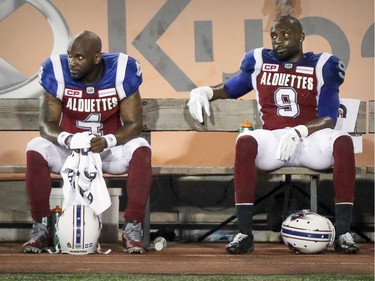 Montreal Alouettes quarterback Darian Durant, left, and reciever Ernest Jackson watch the final moments of their team's loss to the British Columbia Lions during Canadian Football League game in Montreal Thursday July 6, 2017.