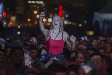 A member of the audience grabs a selfie during the outdoor blowout concert featuring Anderson .Paak at the Montreal International Jazz Festival, in Montreal, on Saturday, July 8, 2017.