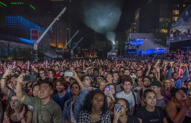 The crowd at the main stage wait for a performance by Anderson .Paak at the outdoor blowout concert at the Montreal International Jazz Festival, in Montreal, on Saturday, July 8, 2017.