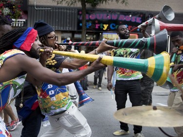 Musicians perform as they march along Ste-Catherine St. during the annual Carifiesta parade in Montreal on Saturday July 8, 2017.