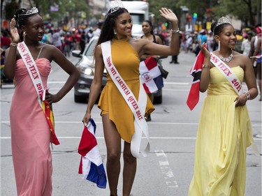 The Carnival Queen, centre, waves to the crowd during the annual Carifiesta parade in Montreal on Saturday July 8, 2017.