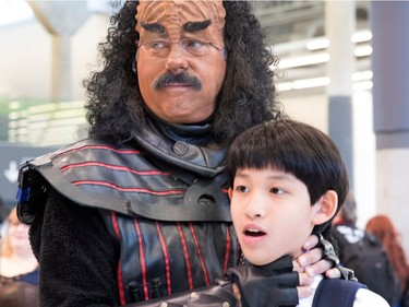 Alex Qiu is strangled by a Klingon as his mother takes pictures of them at Comiccon in Montreal on Sunday July 9, 2017.