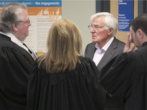 Mike Mergl, founder of excavation firm Construction Mergad,  talks to lawyers at the Laval courthouse on Tuesday, July 11, 2017.