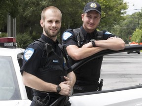 Montreal police Const. Rafael Beaulieu, left, and partner Simon Lavoie outside police station 26 on Monday July 10, 2017. The Montreal police constables made a dramatic rescue on Victoria Ave. Saturday.