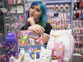 Virginie Lemelin's hair matches the array of unicorn wares for sale at the Montreal accessory store Claire's.