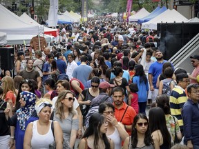 People fill Ste-Catherine St. near Peel during a street festival in Montreal July 16, 2017.