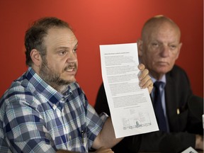 Benoit Dorais, left, mayor of the Sud-Ouest borough and real estate developer Peter Sergakis at a meeting of Notre-Dame Street business owners on July 17.