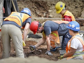Archeologists work at the site of Canada's first parliament at Place d'Youville in Montreal Tuesday July 18, 2017. The building was burned down by an angry anglo mob in 1849.